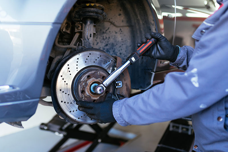 mechanic working on disc brake